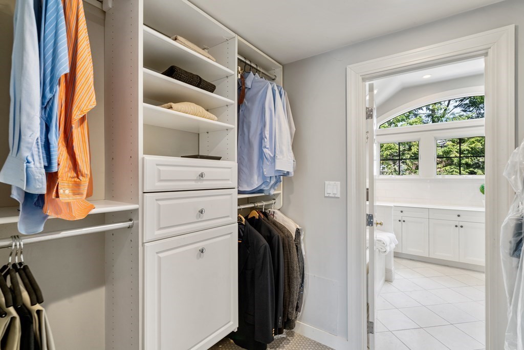 74 Shaw Road Belmont, MA 02478 - Photo 17 of 31 a view of walk in closet with clothes and shoes