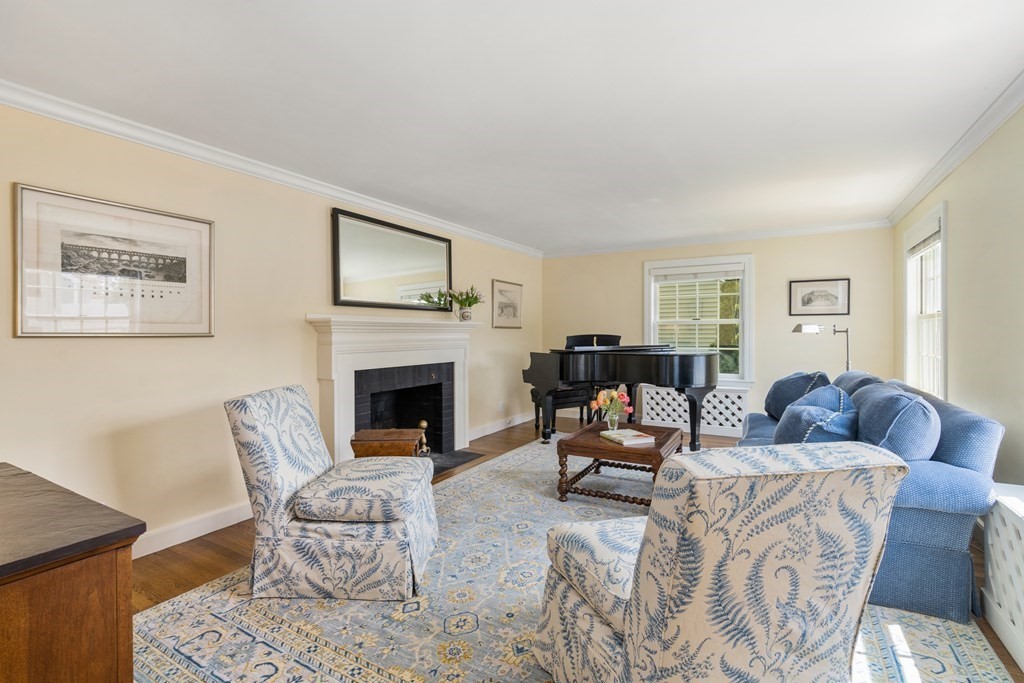 74 Shaw Road Belmont, MA 02478 - Photo 2 of 31 a living room with furniture and a fireplace