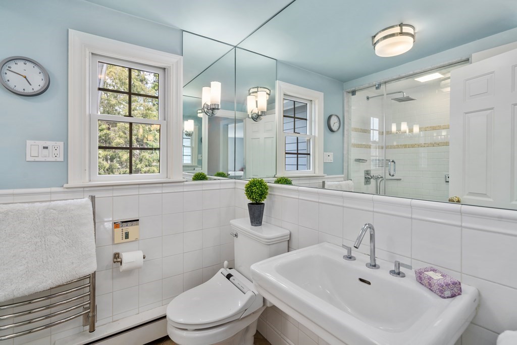 74 Shaw Road Belmont, MA 02478 - Photo 22 of 31 a bathroom with a sink a toilet and mirror
