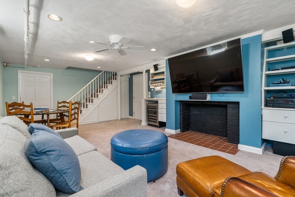 74 Shaw Road Belmont, MA 02478 - Photo 23 of 31 a living room with furniture fireplace and flat screen tv