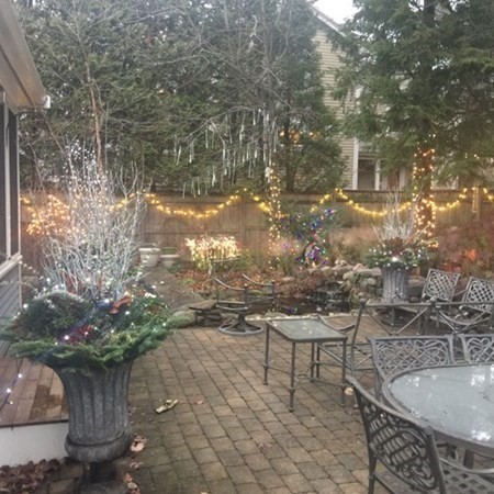 74 Shaw Road Belmont, MA 02478 - Photo 30 of 31 a backyard of a house with table and chairs