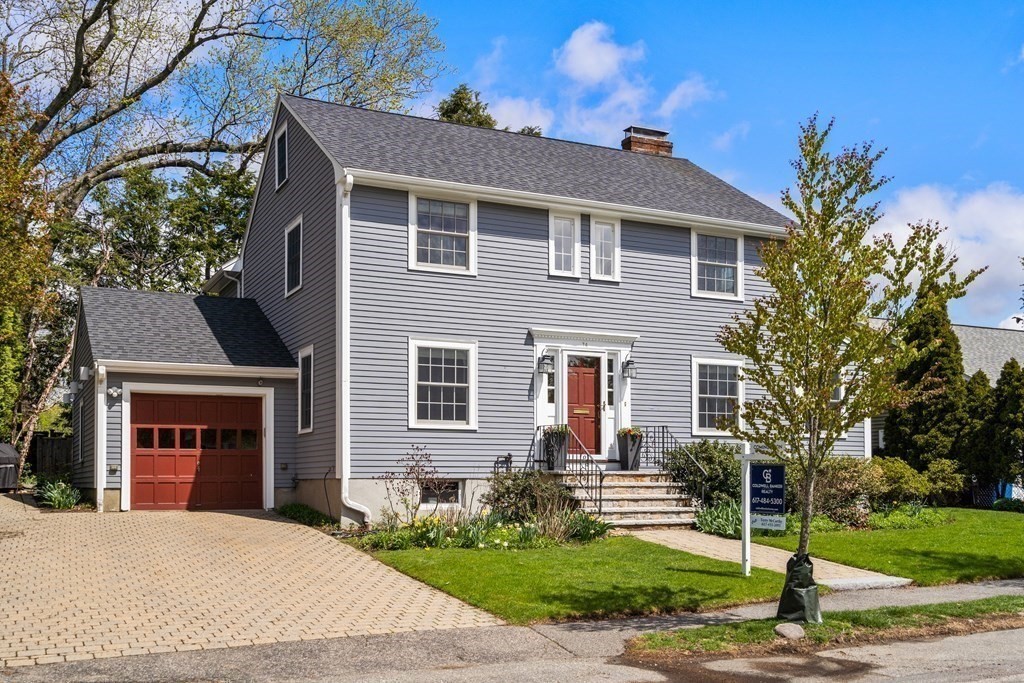 74 Shaw Road Belmont, MA 02478 - Photo 31 of 31 a front view of a house with a yard and garage