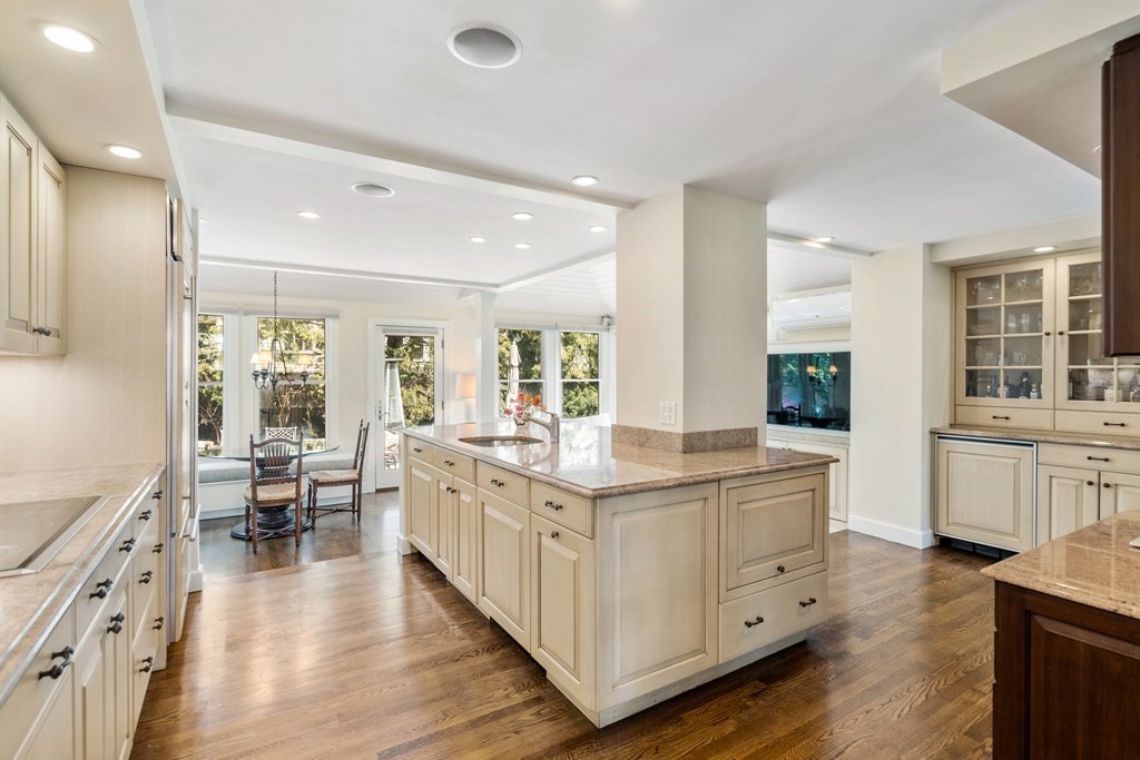 74 Shaw Road Belmont, MA 02478 - Photo 6 of 31 a large kitchen with stainless steel appliances kitchen island granite countertop a large counter top and sink