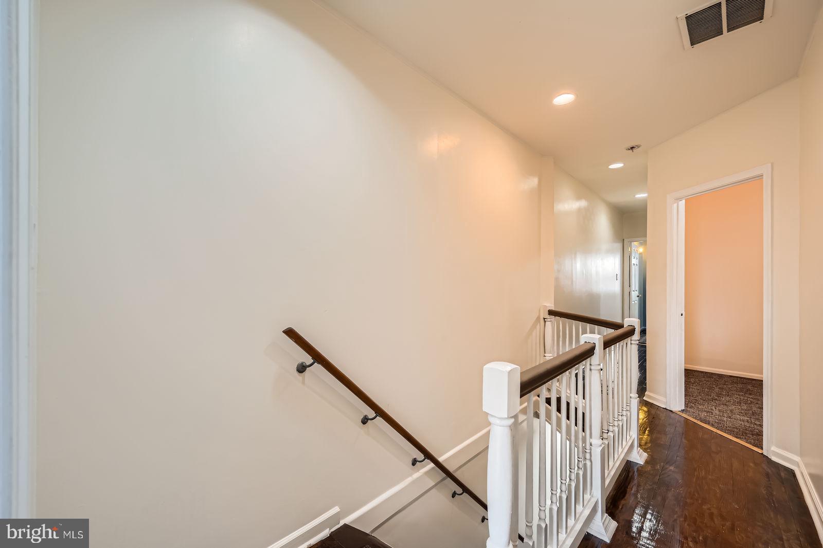 2015 East North Avenue Baltimore, MD 21213 - Photo 28 of 34 a view of staircase with railing and white walls