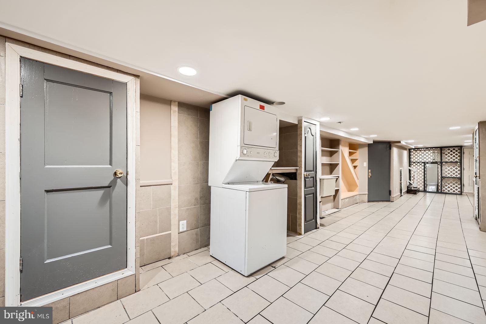 2015 East North Avenue Baltimore, MD 21213 - Photo 33 of 34 a kitchen with a refrigerator and white cabinets