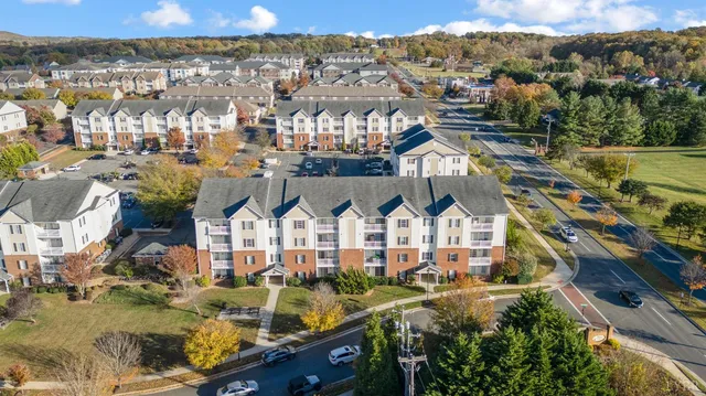 a view of houses with a street