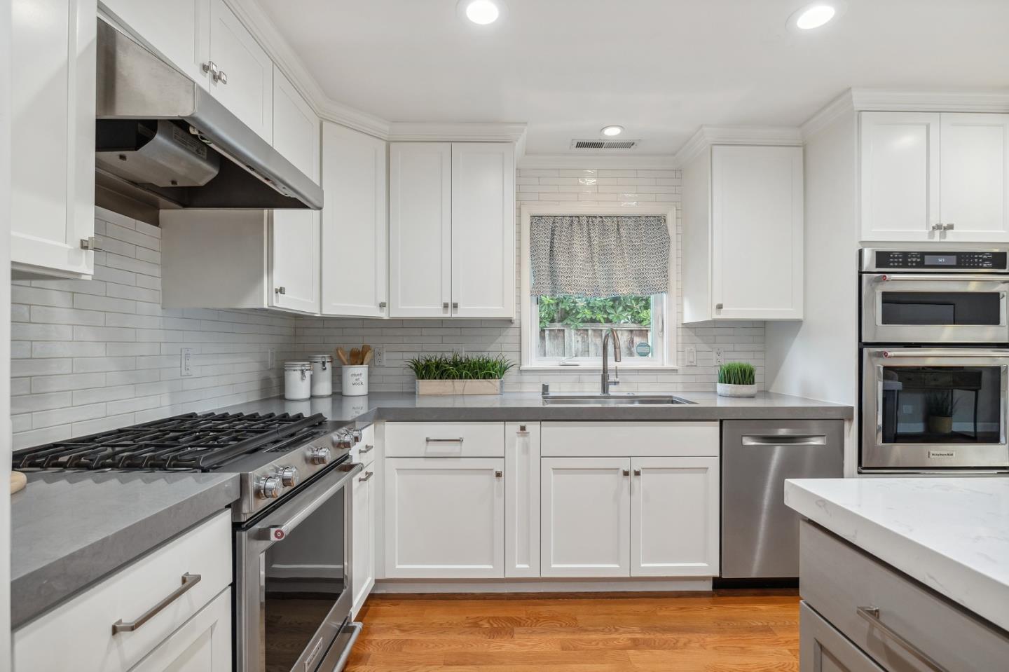 5236 Roxanne Drive San Jose, CA 95124 - Photo 11 of 35 a kitchen with white cabinets and appliances