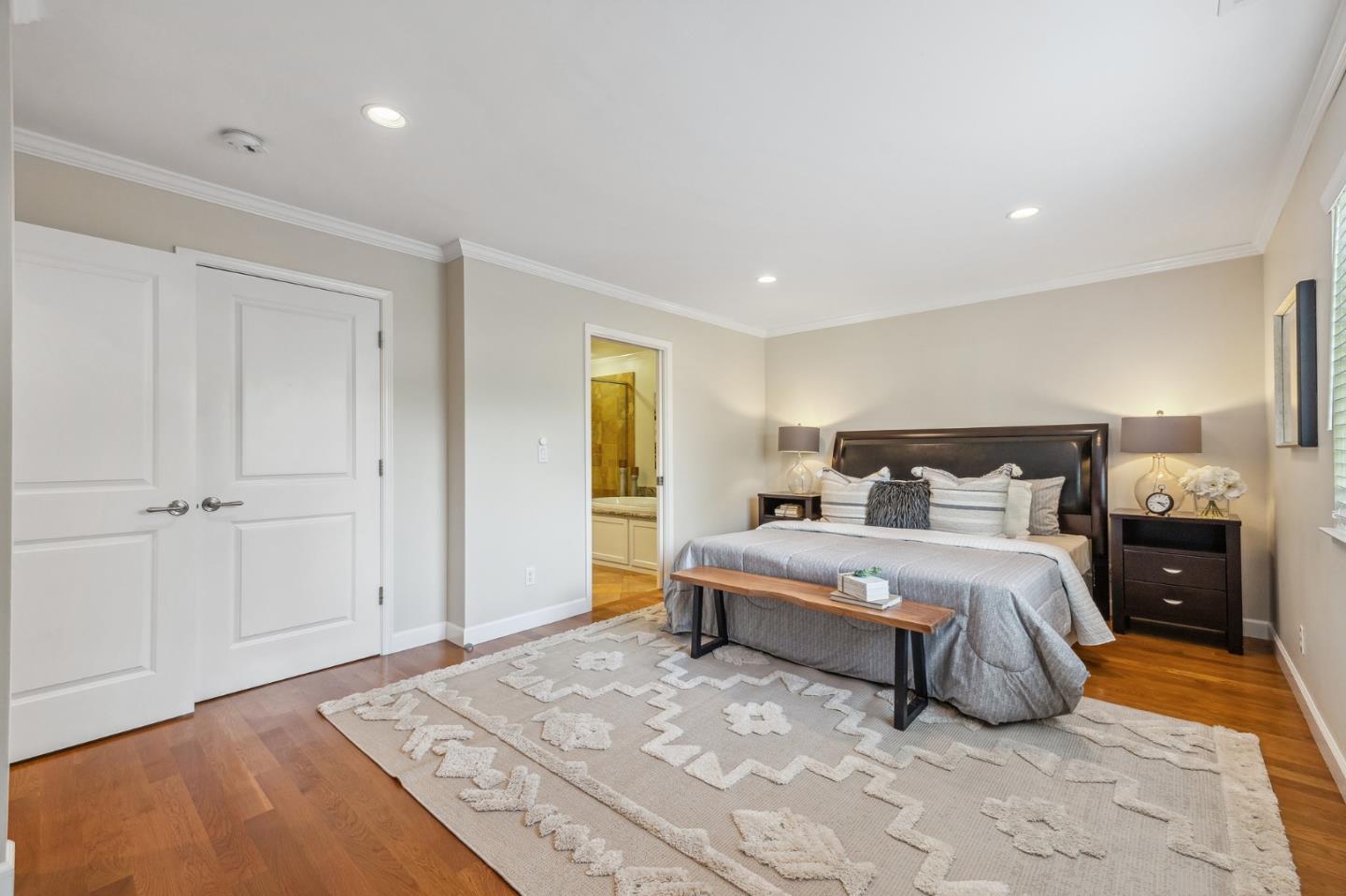 5236 Roxanne Drive San Jose, CA 95124 - Photo 20 of 35 a spacious bedroom with a bed and a lamp