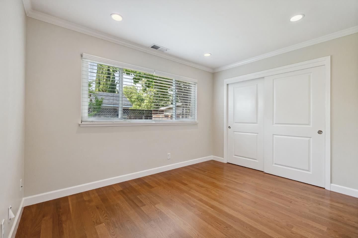 5236 Roxanne Drive San Jose, CA 95124 - Photo 26 of 35 a view of empty room with wooden floor and fan