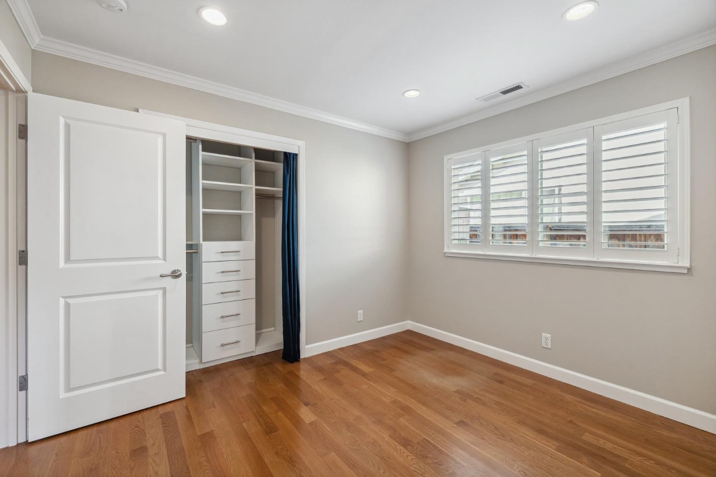 5236 Roxanne Drive San Jose, CA 95124 - Photo 27 of 35 an empty room with wooden floor closet and windows