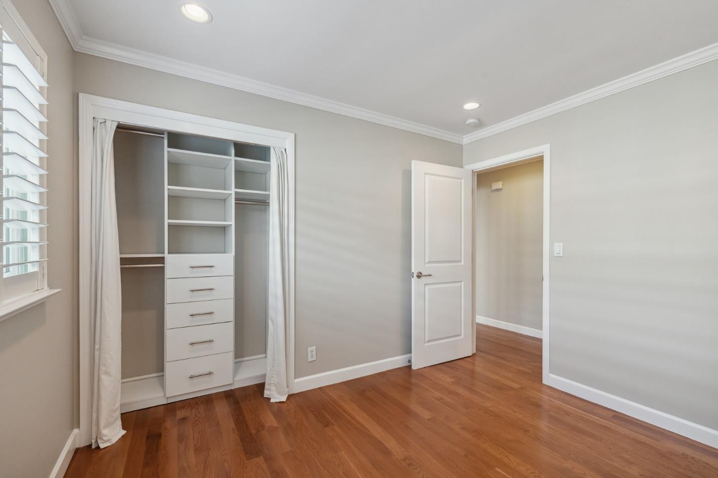 5236 Roxanne Drive San Jose, CA 95124 - Photo 29 of 35 a view of an empty room with cabinet and wooden floor