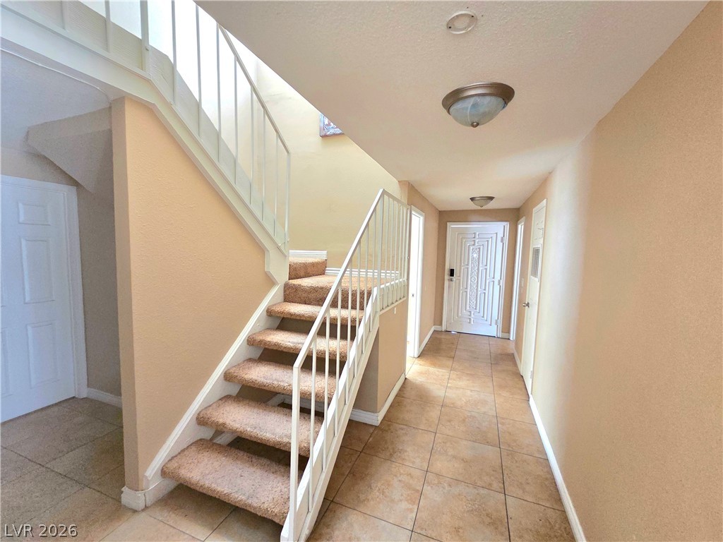 3648 Bronco Road Las Vegas, NV 89103 - Photo 19 of 24 A well-maintained staircase welcomes residents and guests to this inviting entry.