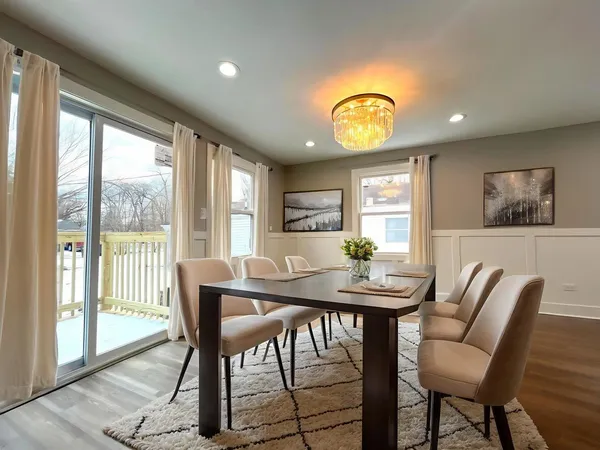a view of a dining room with furniture window and outside view