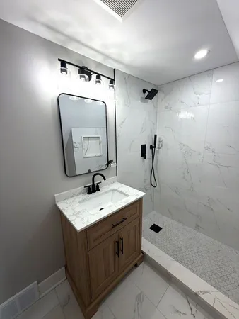 a bathroom with a sink and a mirror