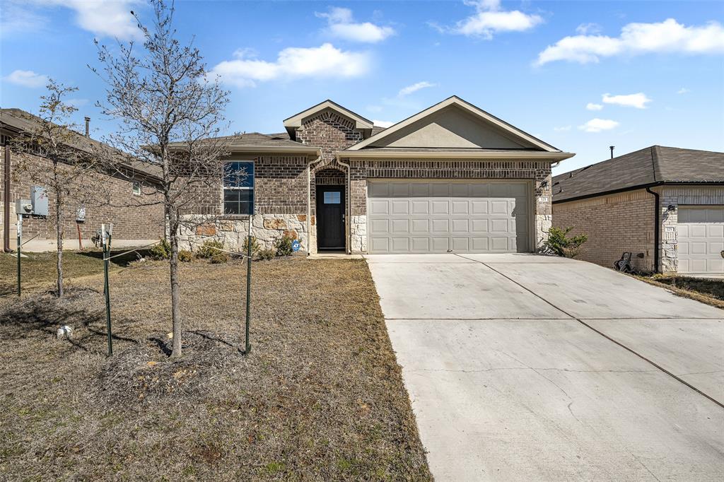 121 Mackinac Lane Georgetown, TX 78626 - Photo 1 of 16 a front view of a house with a yard and garage