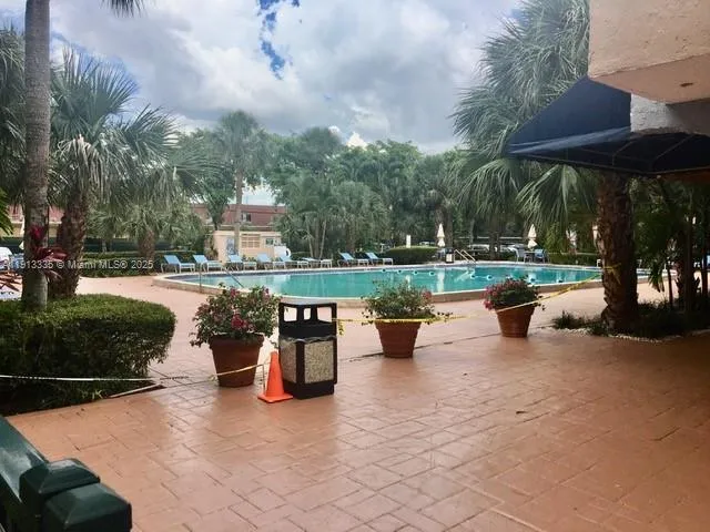 a view of a backyard with sitting area