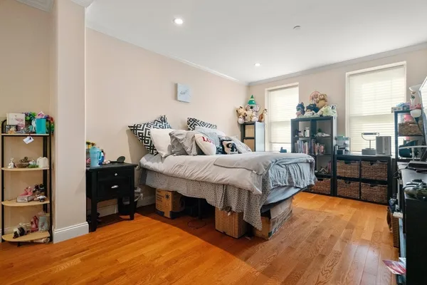 a bed room with a bed and a chair