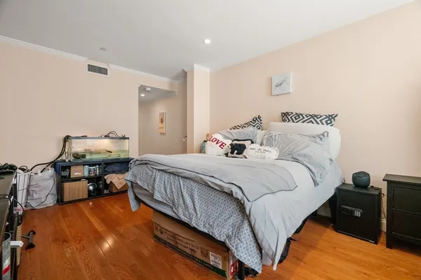 a bedroom with bed and window