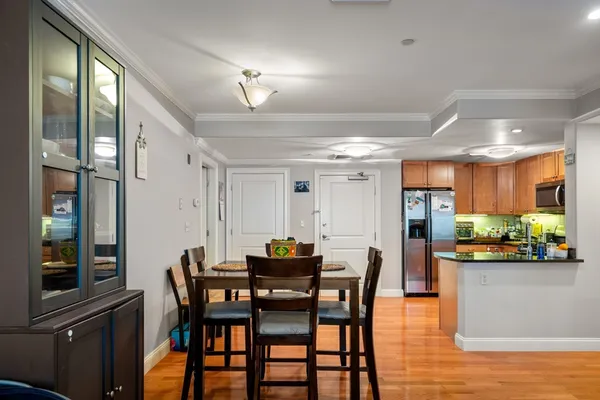 a dining room with furniture and window