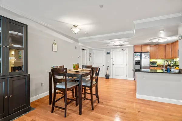 a view of a dining room with furniture and wooden floor