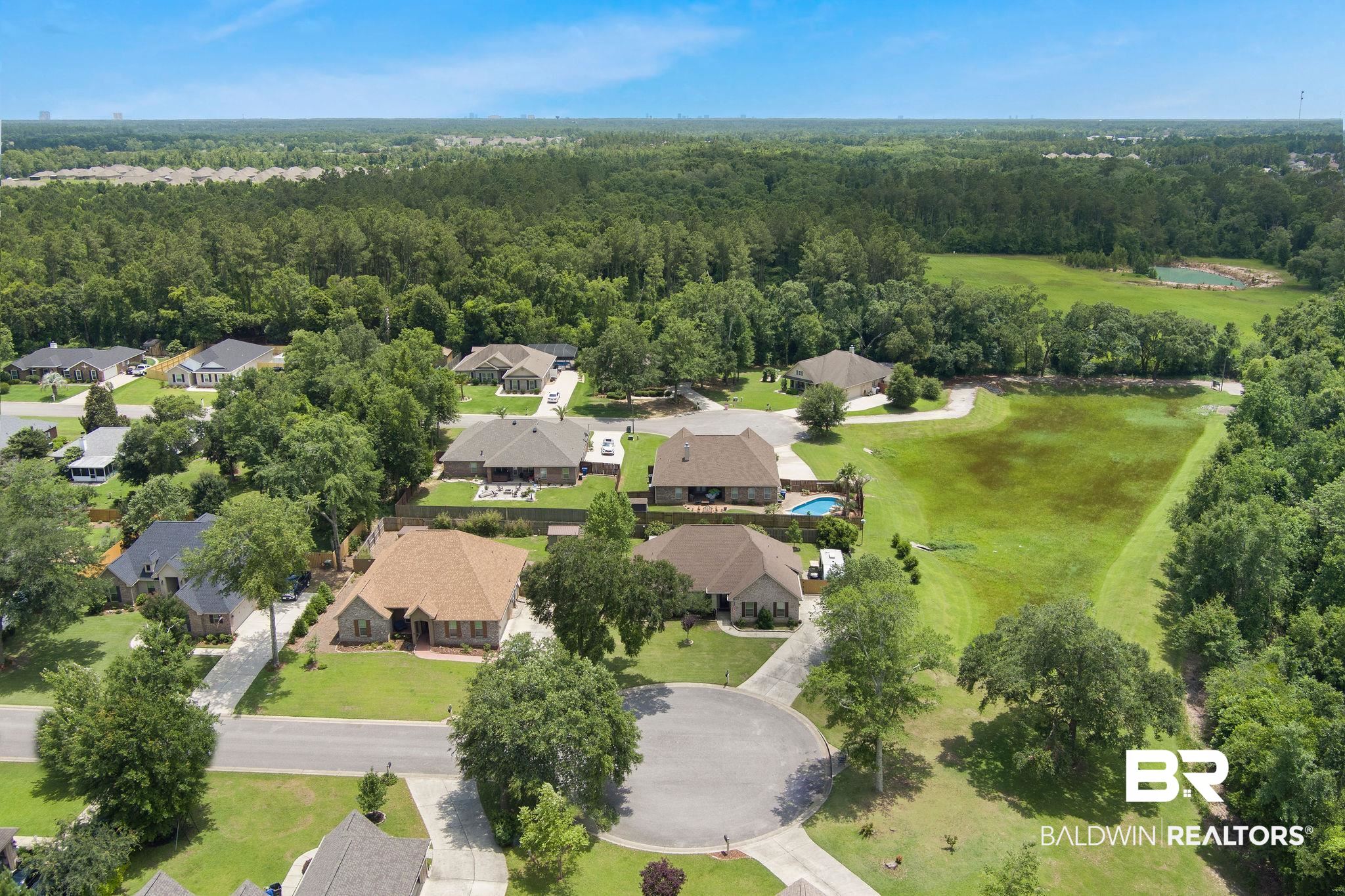 1090 Destin Avenue Foley, AL 36535 - Photo 29 of 30 Aerial view of residential area with a forest