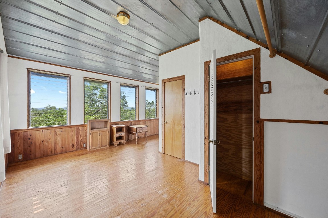 15207 Farm To Market Road 2769 Volente, TX 78641 - Photo 22 of 26 a view of livingroom with furniture and floor to ceiling window