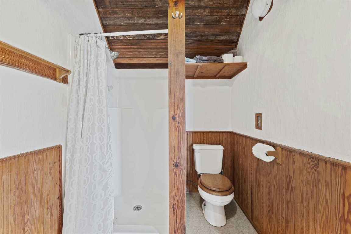 15207 Farm To Market Road 2769 Volente, TX 78641 - Photo 24 of 26 a bathroom with a toilet