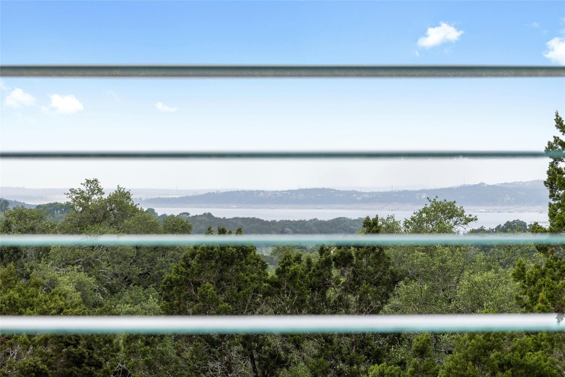 15207 Farm To Market Road 2769 Volente, TX 78641 - Photo 26 of 26 a view of a lake with a big yard