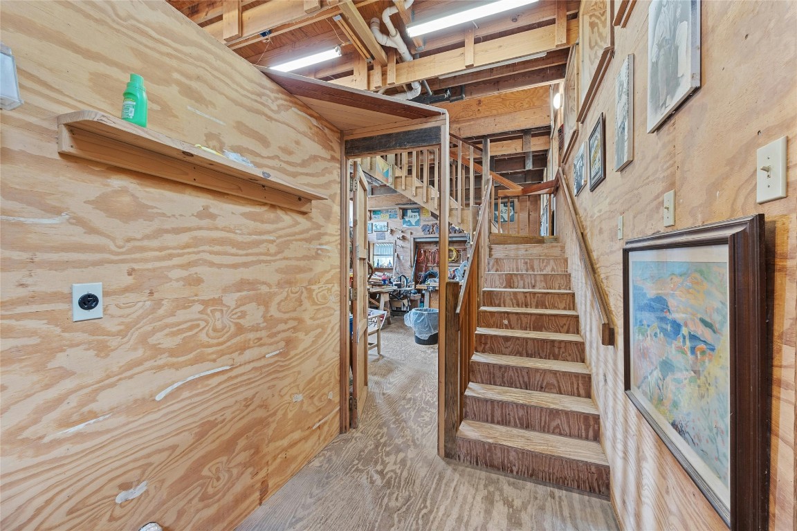 15207 Farm To Market Road 2769 Volente, TX 78641 - Photo 10 of 26 a view of entryway with wooden floor and stairs