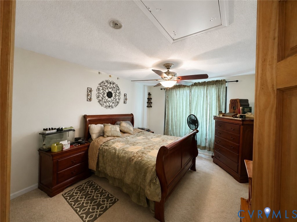 5704 Brills Road McKenney, VA 23872 - Photo 4 of 8 a bedroom with a bed and wooden floor