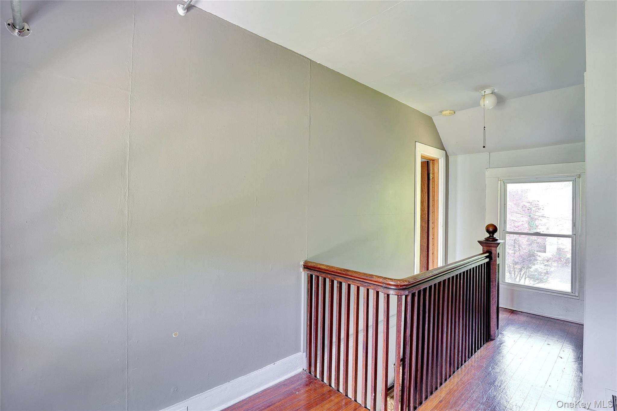 500 Haverstraw Road Suffern, NY 10901 - Photo 18 of 36 a view of a bedroom with wooden floor and windows