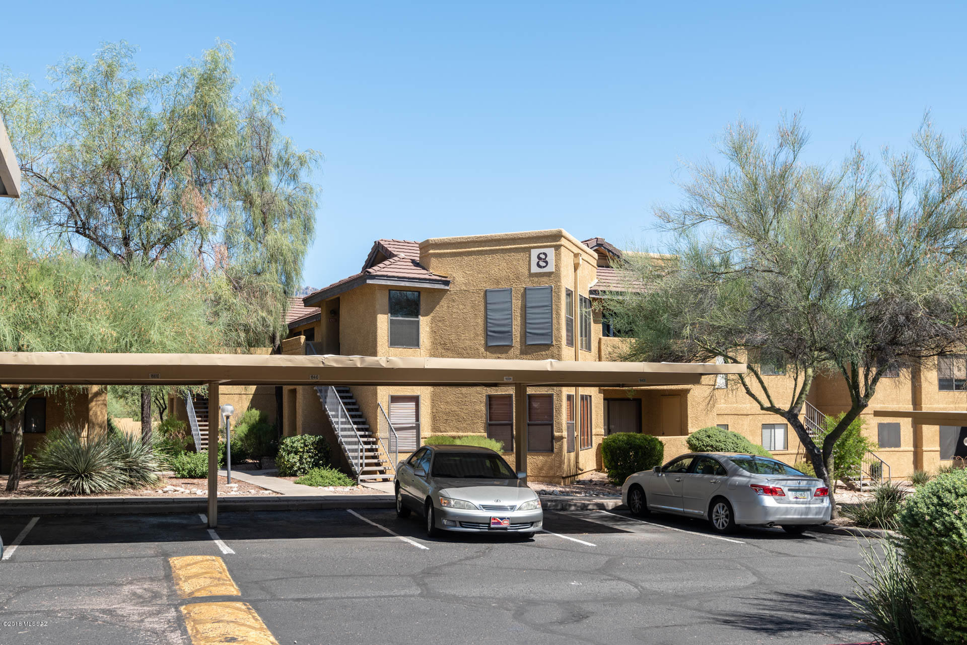 7255 East Snyder Road, Unit 8205 Tucson, AZ 85750 - Photo 23 of 23 a front view of a house with a garden
