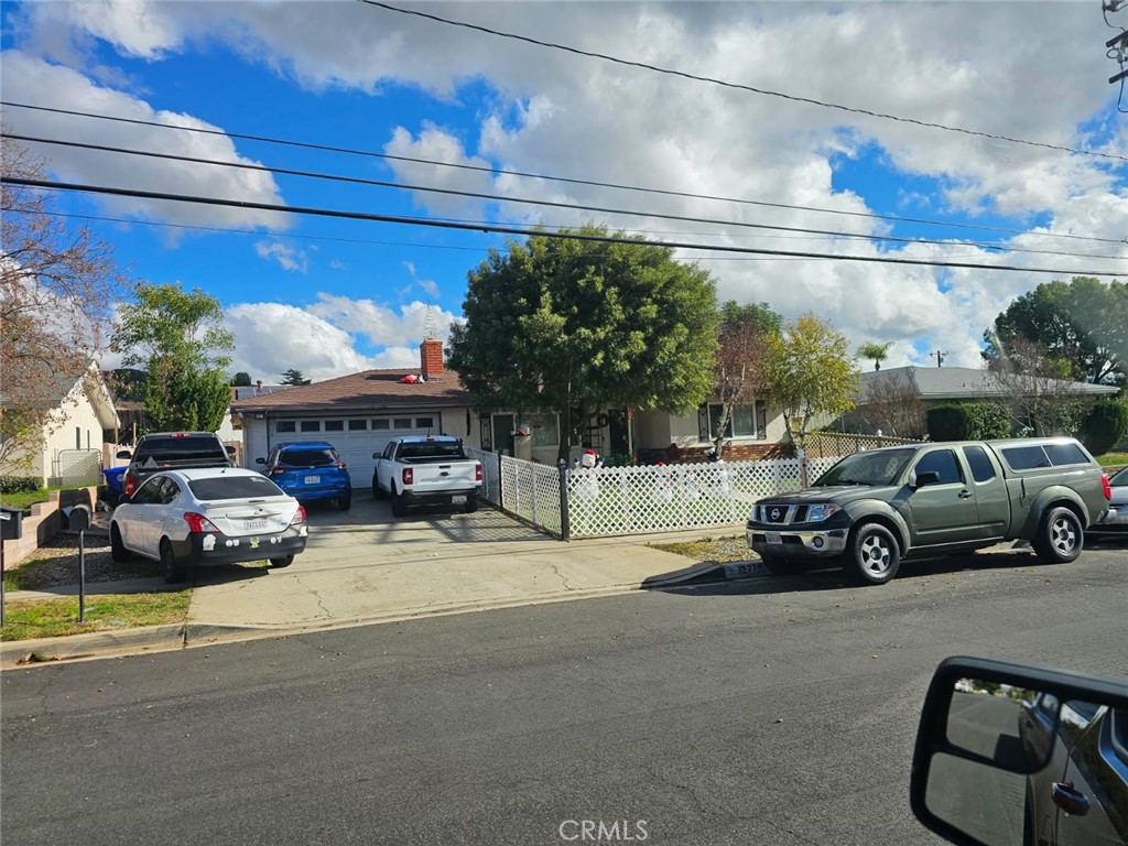 a view of street with parked cars