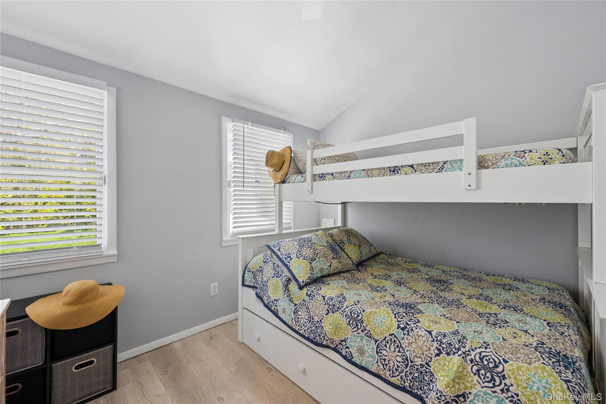 57 Kyle Road Hampton Bays, NY 11946 - Photo 13 of 19 a bedroom with a bed and window