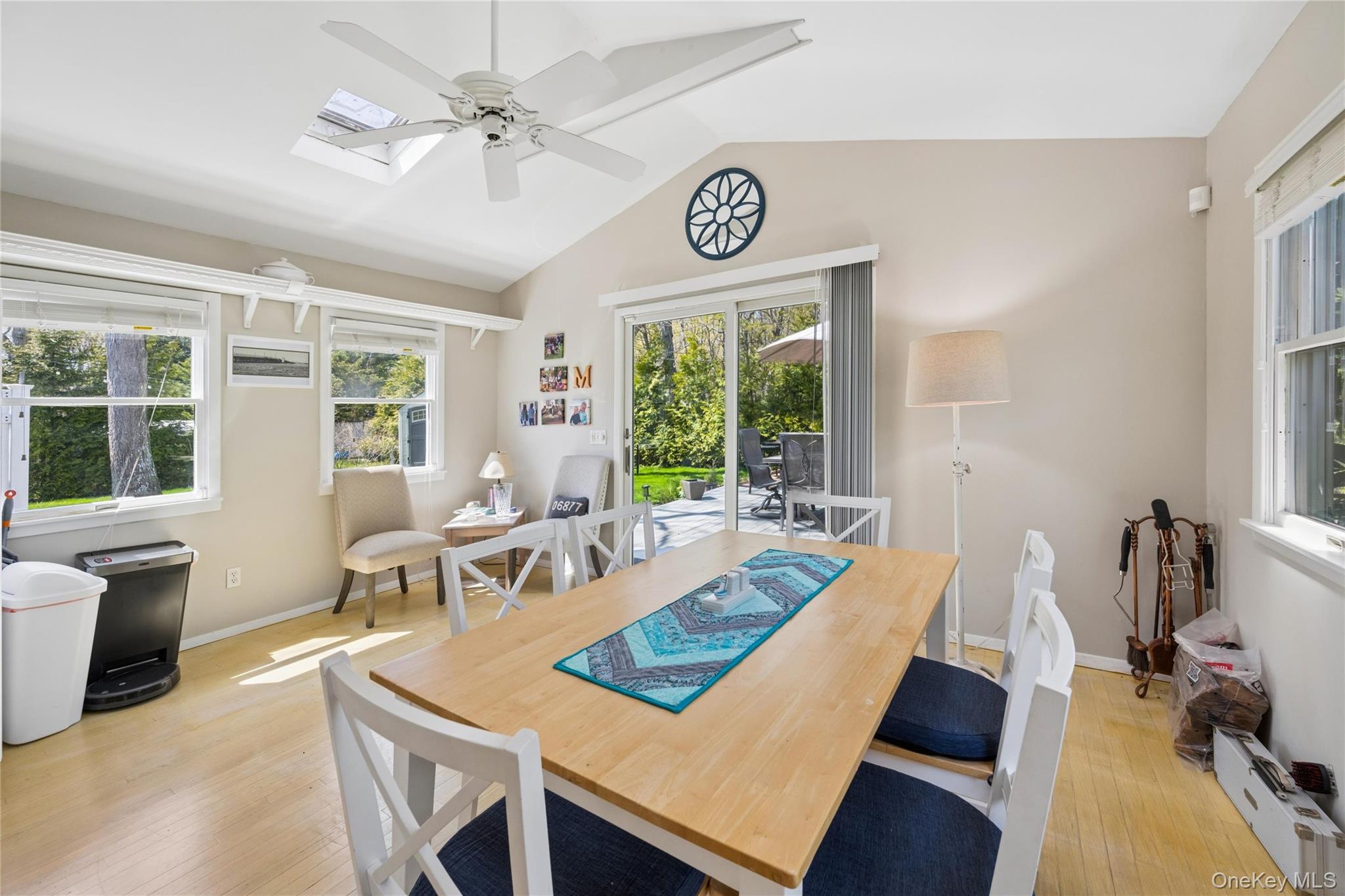 57 Kyle Road Hampton Bays, NY 11946 - Photo 5 of 19 a view of a dining room with furniture window and outside view