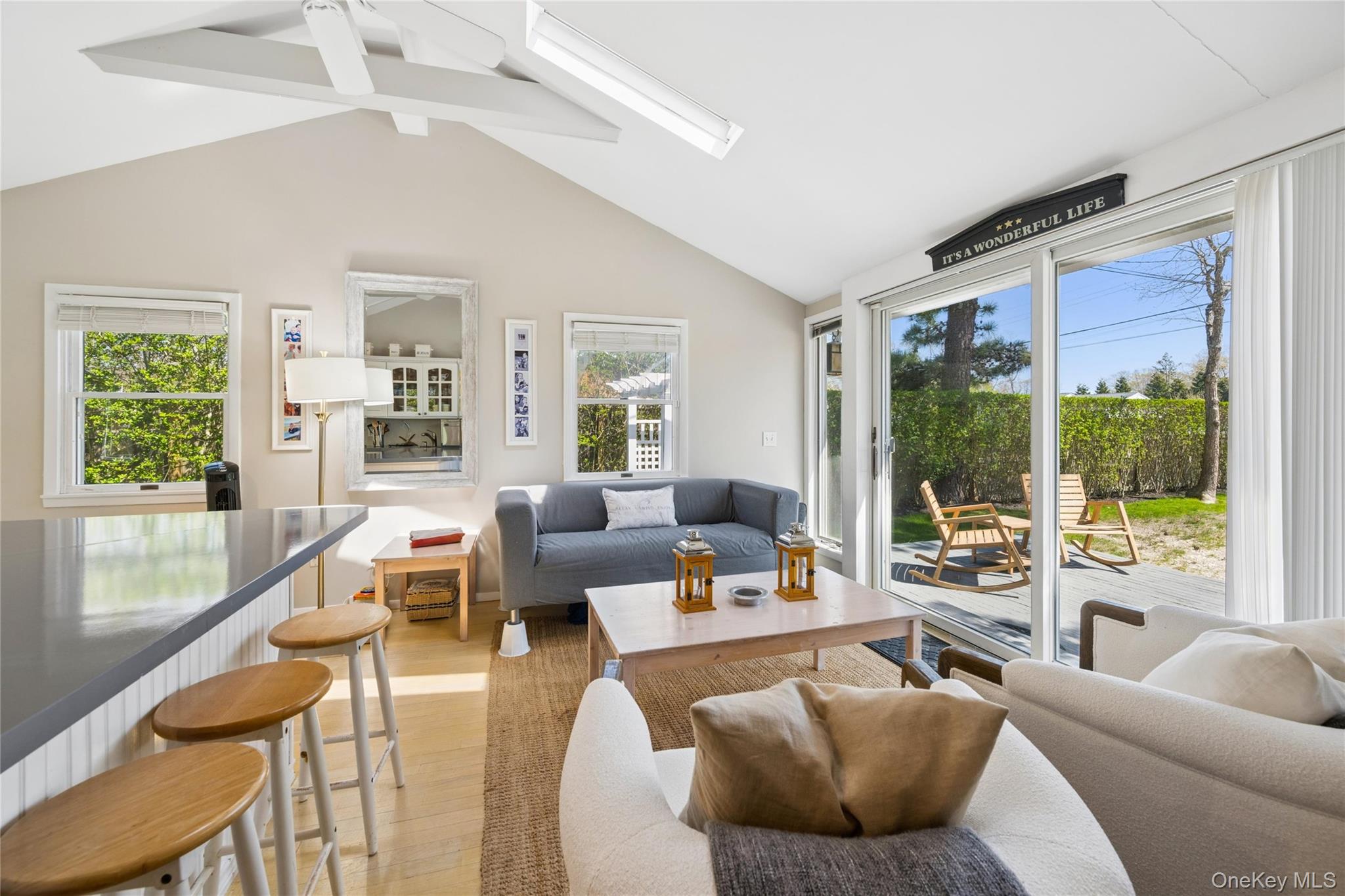 57 Kyle Road Hampton Bays, NY 11946 - Photo 8 of 19 a living room with furniture and a large window