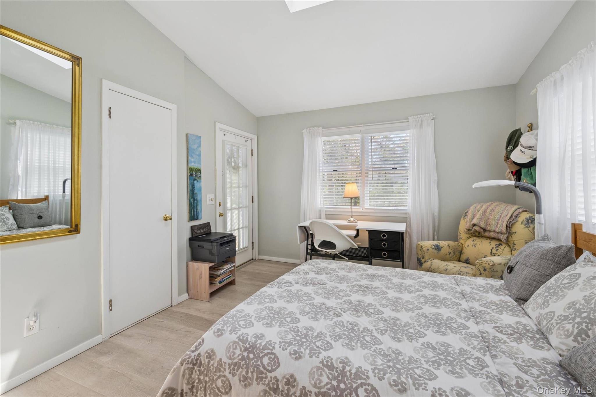 57 Kyle Road Hampton Bays, NY 11946 - Photo 9 of 19 a bedroom with furniture and a large window