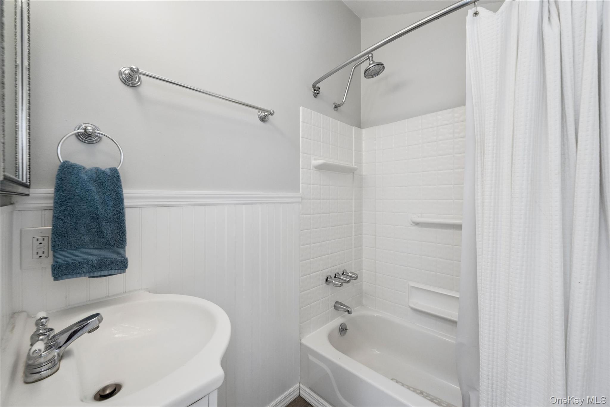 57 Kyle Road Hampton Bays, NY 11946 - Photo 10 of 19 a bathroom with a sink and a tub