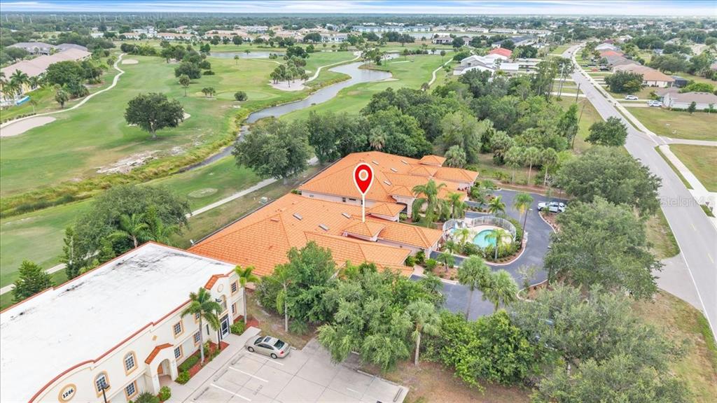 1260 Rio De Janeiro Avenue, Unit 102 Punta Gorda, FL 33983 - Photo 40 of 46 an aerial view of residential houses with outdoor space and trees