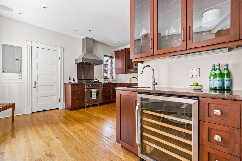 1 Clinton Path, Unit 2 Brookline, MA 02445 - Photo 13 of 28 a kitchen with stainless steel appliances granite countertop a stove and a refrigerator