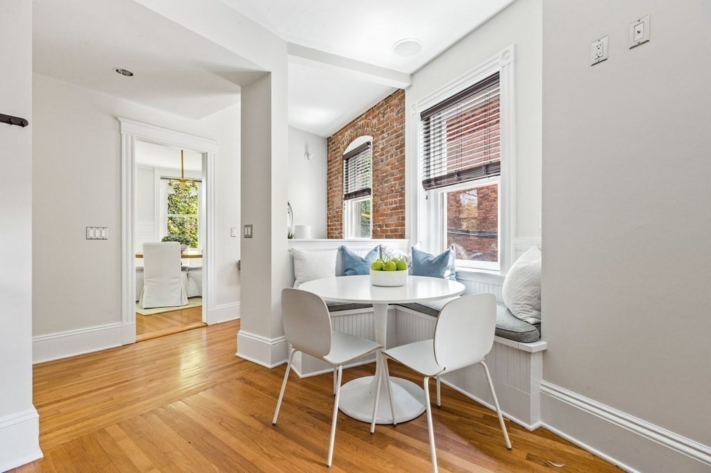 1 Clinton Path, Unit 2 Brookline, MA 02445 - Photo 15 of 28 a view of a dining room with furniture and wooden floor