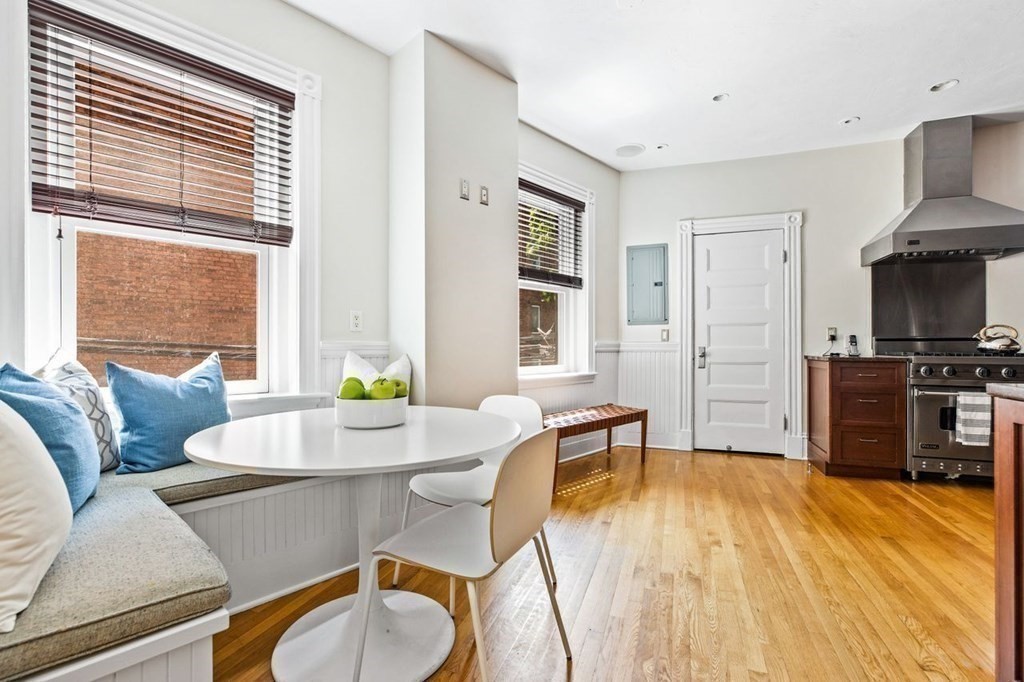 1 Clinton Path, Unit 2 Brookline, MA 02445 - Photo 16 of 28 a living room with furniture and a flat screen tv