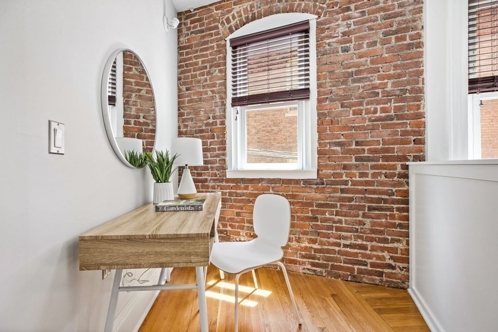 1 Clinton Path, Unit 2 Brookline, MA 02445 - Photo 17 of 28 a view of a workspace with furniture and a window