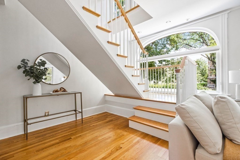 1 Clinton Path, Unit 2 Brookline, MA 02445 - Photo 19 of 28 a living room with a bed furniture and a window
