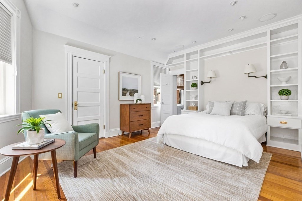 1 Clinton Path, Unit 2 Brookline, MA 02445 - Photo 20 of 28 a spacious bedroom with a bed and a table chair