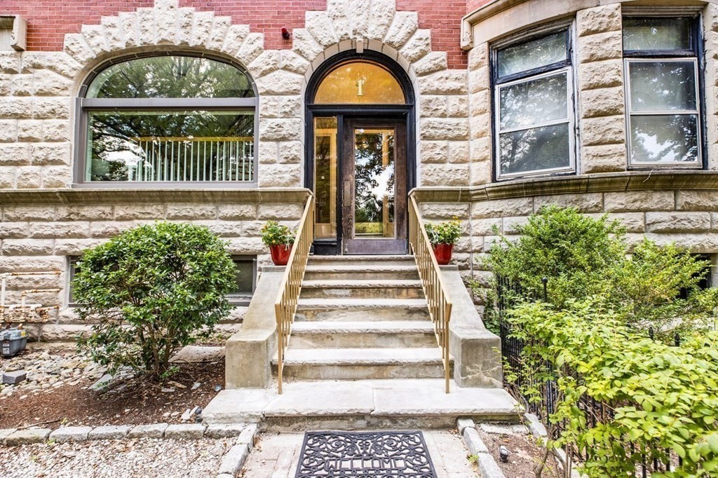 1 Clinton Path, Unit 2 Brookline, MA 02445 - Photo 2 of 28 a front view of a house with a garden