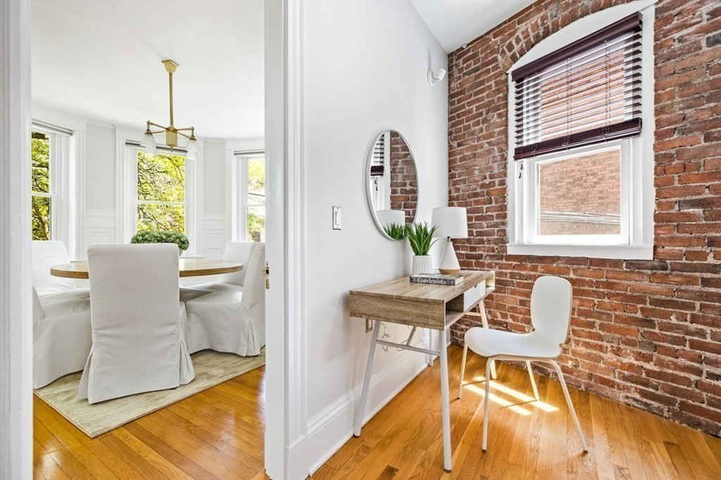 1 Clinton Path, Unit 2 Brookline, MA 02445 - Photo 10 of 28 a view of a dining room with furniture and windows