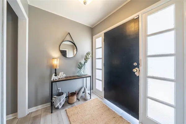 a bedroom with a bed and a mirror