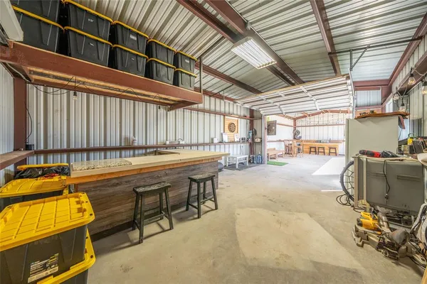 a balcony with table and chairs