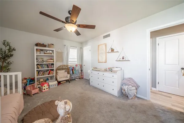 a bed room with a bed and a window